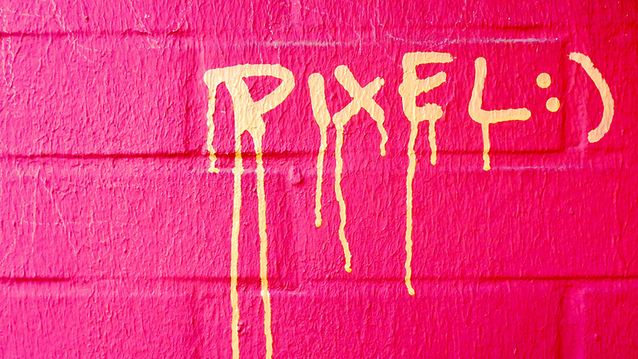Graffiti "Pixel :)" on a wall